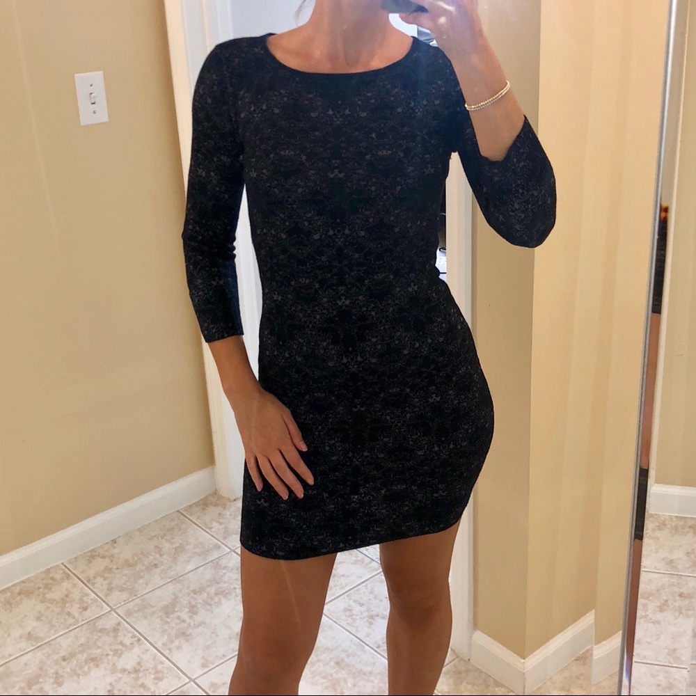 H&M black mini sweater dress with design size S.